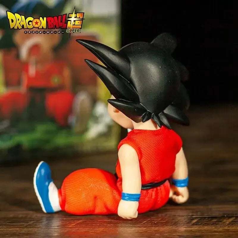 10cm Dragon Ball Z Anime Kakarotto Gk Pvc Action Figure Auto Accessories Sitting Posture Sleep Son Goku Model Toys Gifts